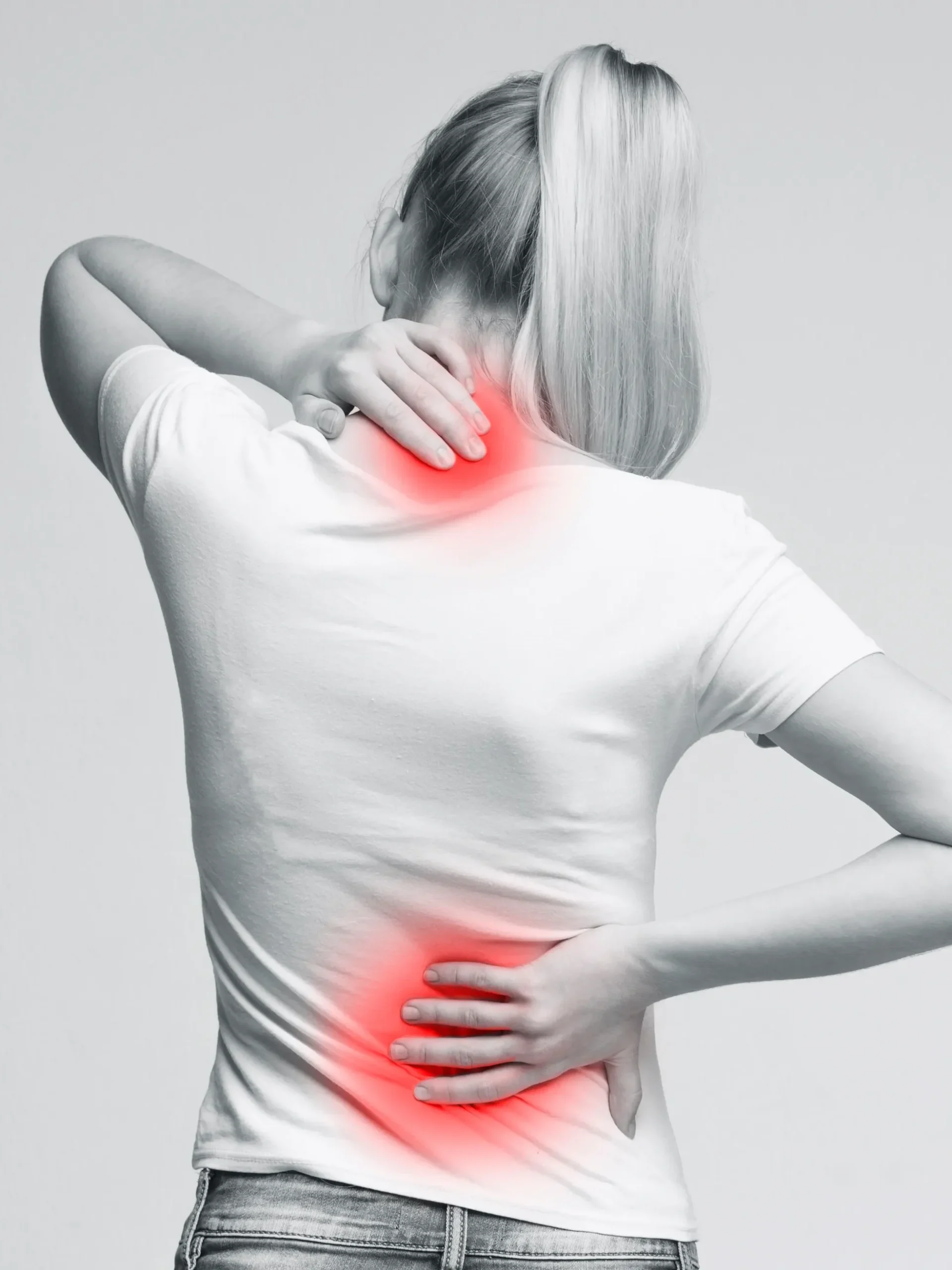 woman in pain holding her neck and lower back
